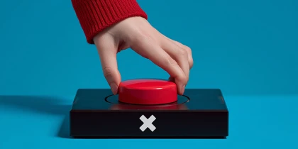 red button is pressed by a hand